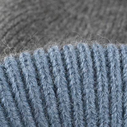Gray colorblock plush lined pom knit beanie detail