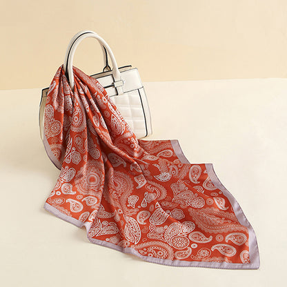 Scarvii Paisley scarf head wrap tied around a mannequin head