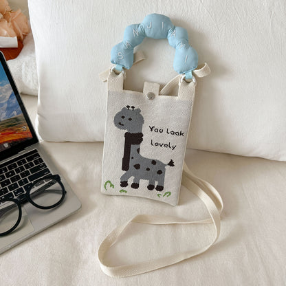 Cosbai mini knitted crossbody and handbag held by hand showing size