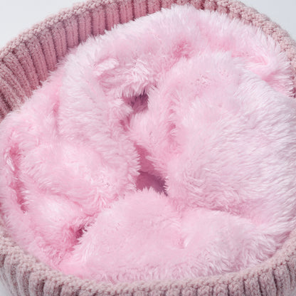 Pink plush lined cable knit pom beanie detail