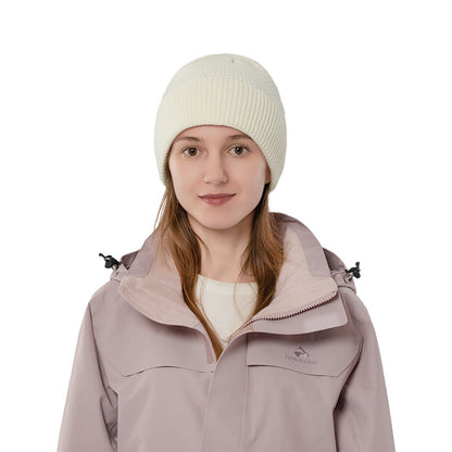 Ivory ribbed cuff knit beanie front view on a model