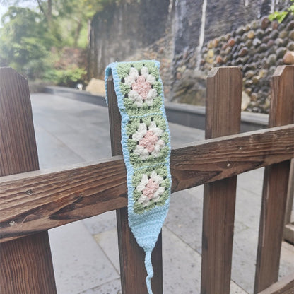 Scarvii crochet flower hairband with a focus on the flower texture