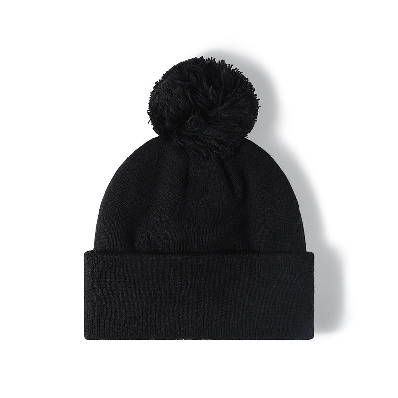 Black plush lined pom cuffed knit beanie overview