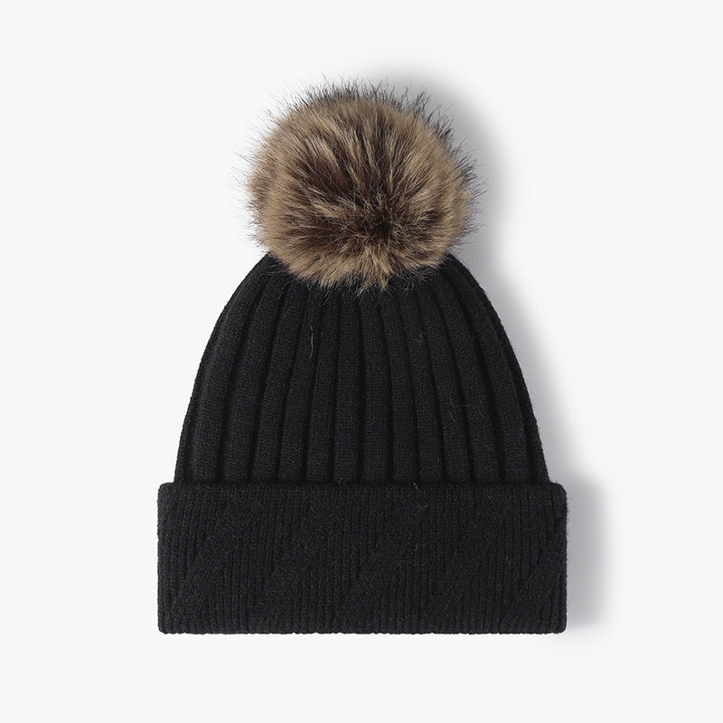 Black faux fur-lined pom-pom textured knit beanie product view