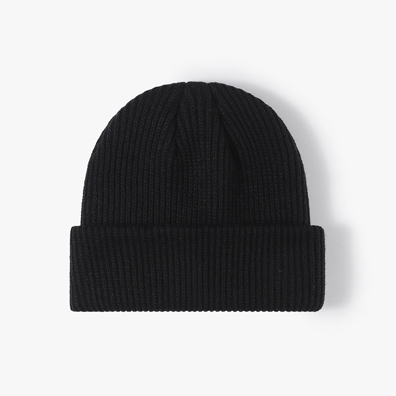 Black solid ribbed cuffed acrylic knit beanie product view