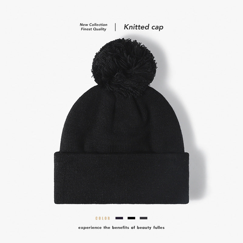 Black plush lined pom cuffed knit beanie overview