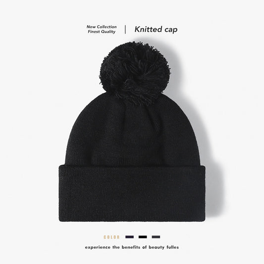 Black plush lined pom cuffed knit beanie overview