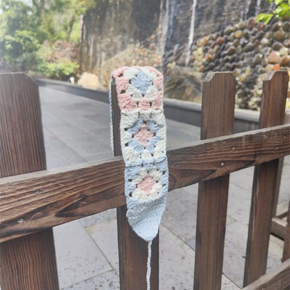 Scarvii crochet flower hairband with flowers evenly spaced along the band