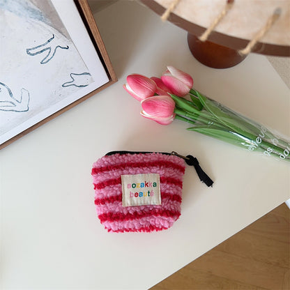 Cosbai Mini Plush Makeup Bag angled close-up of plush texture and zipper