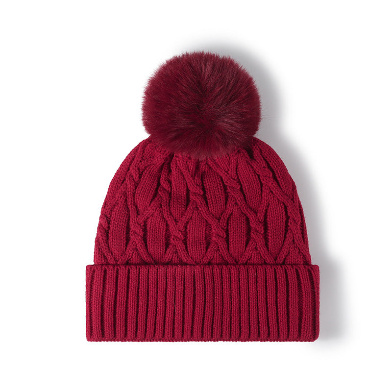 Burgundy cable knit pom-pom cuffed beanie product view