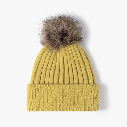 Mustard Yellow faux fur-lined pom-pom textured knit beanie product view