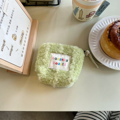 Cosbai Mini Plush Makeup Bag with zipper partially open, pink color