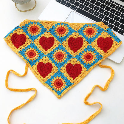 Side view of Scarvii crochet heart hairband showing texture and shape