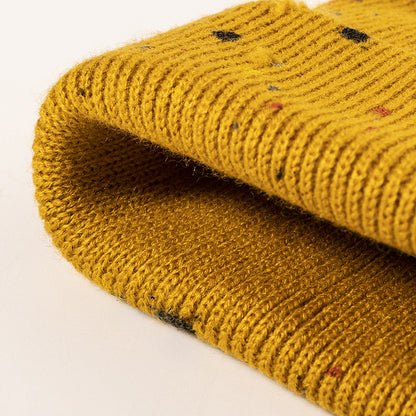 Yellow paint splatter cuffed knit beanie detail
