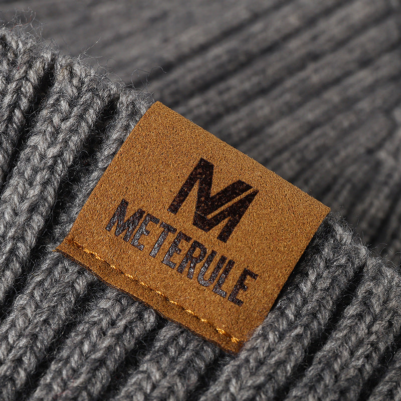 Gray label patch ribbed knit beanie patch detail