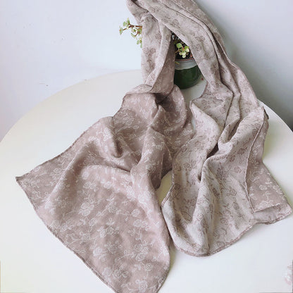 Scarvii plaid boho scarf displayed with soft lighting emphasizing fabric details