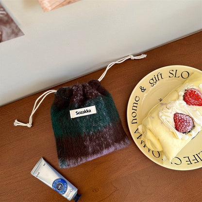 Cosbai cosmetic storage drawstring bag with drawstrings loosened and opening visible