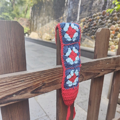 Scarvii crochet flower hairband displayed with soft focus on flower elements