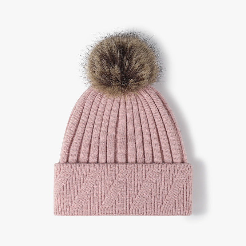 Pink faux fur-lined pom-pom textured knit beanie product view