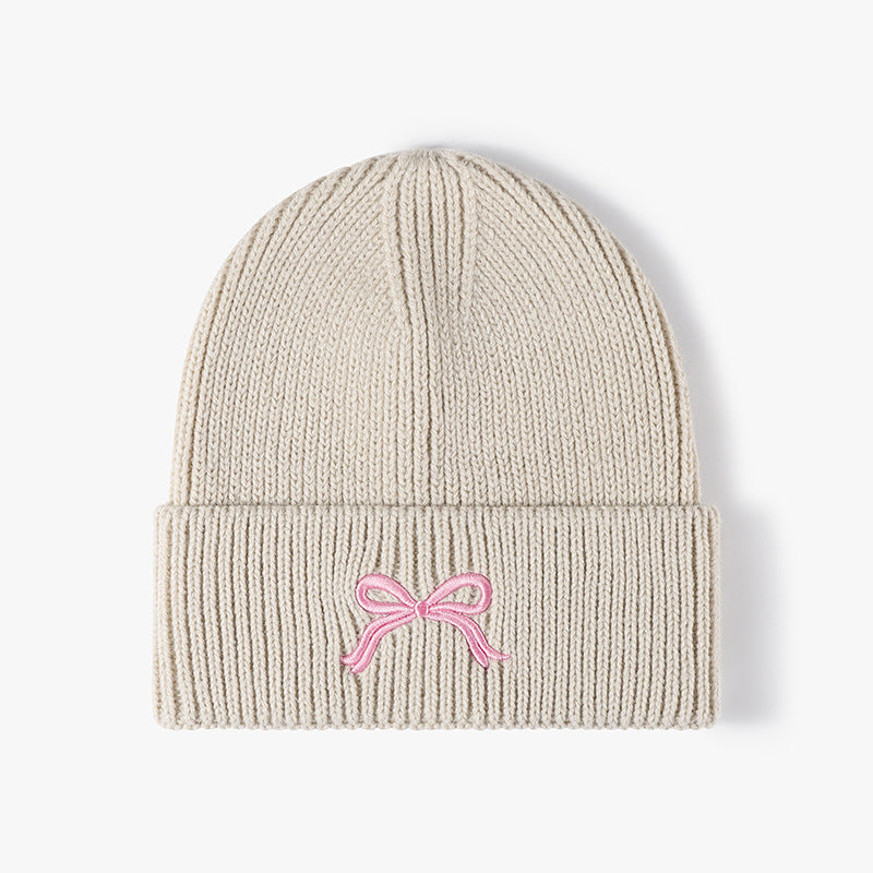 秋冬季蝴蝶结刺绣女士户外保暖针织帽欧美跨境晴纶加厚毛细护耳帽