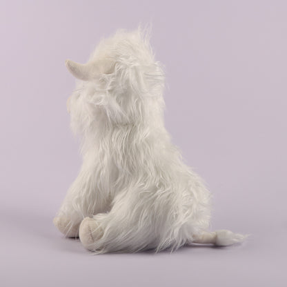 Cow plush toy with embroidered face details