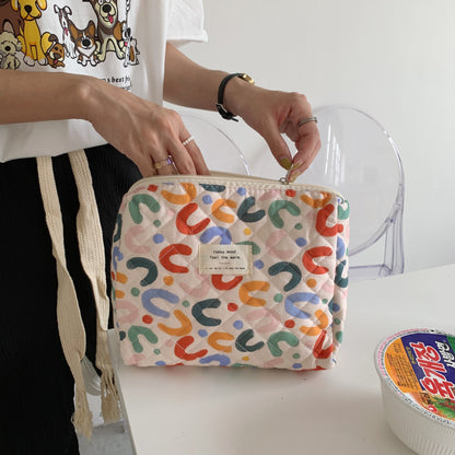 Close-up of Cosbai floral storage purse cosmetic bag showing detailed flower design