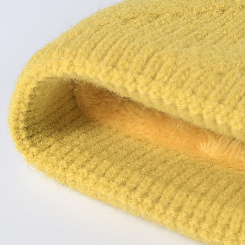 White faux fur-lined pom-pom textured knit beanie product view