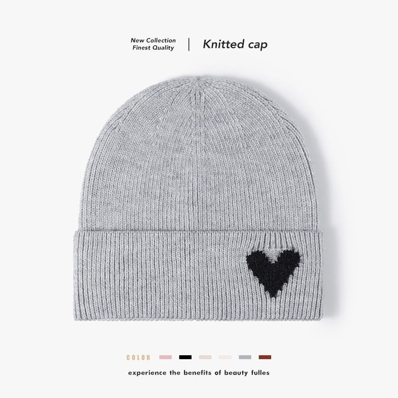 Pink heart accent cuffed knit beanie product view