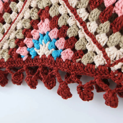 Close-up of tassel and crochet pattern on Crosa Bohemian tank top