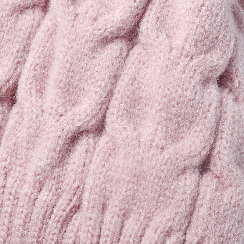 Pink plush lined cable knit pom beanie detail