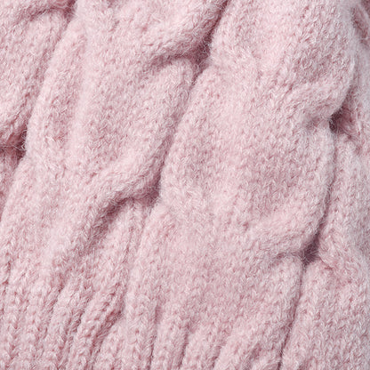 Pink plush lined cable knit pom beanie detail
