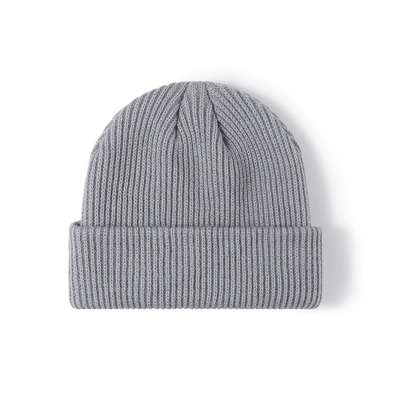Black solid ribbed cuffed acrylic knit beanie product view