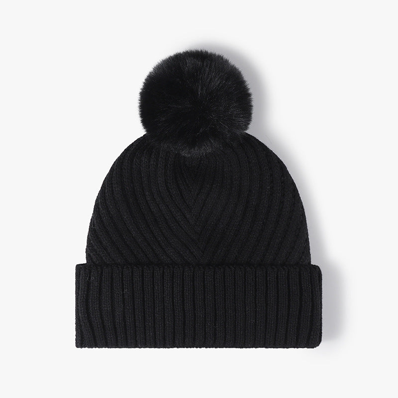 Black pom-pom faux fur-lined cuffed knit beanie product view