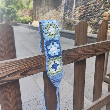Scarvii crochet flower hairband with multiple crochet flowers in a row