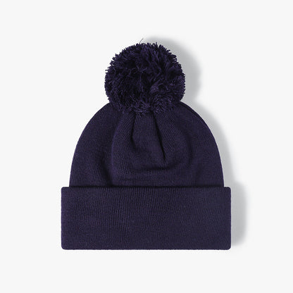 Navy plush lined pom cuffed knit beanie product view