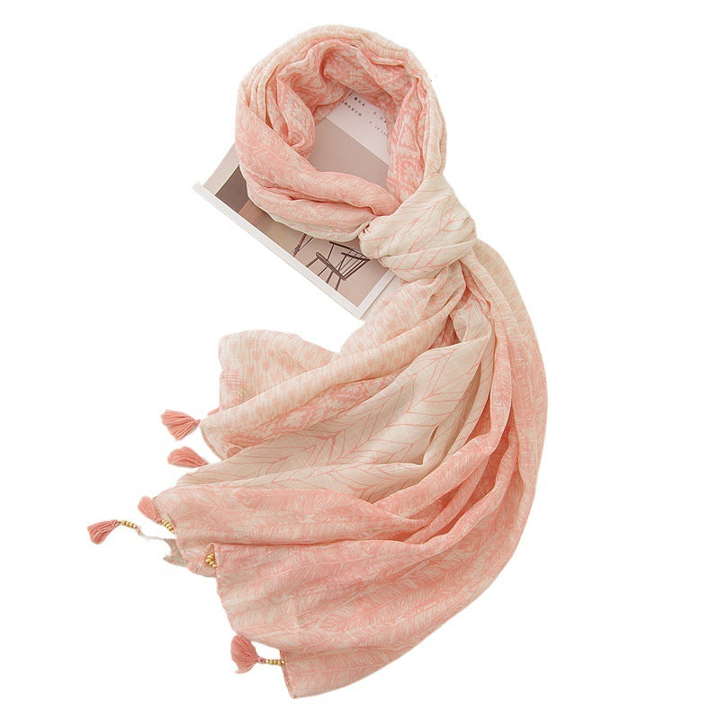 Pink feather print shawl in a draped styling
