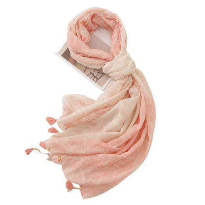 Pink feather print shawl in a draped styling