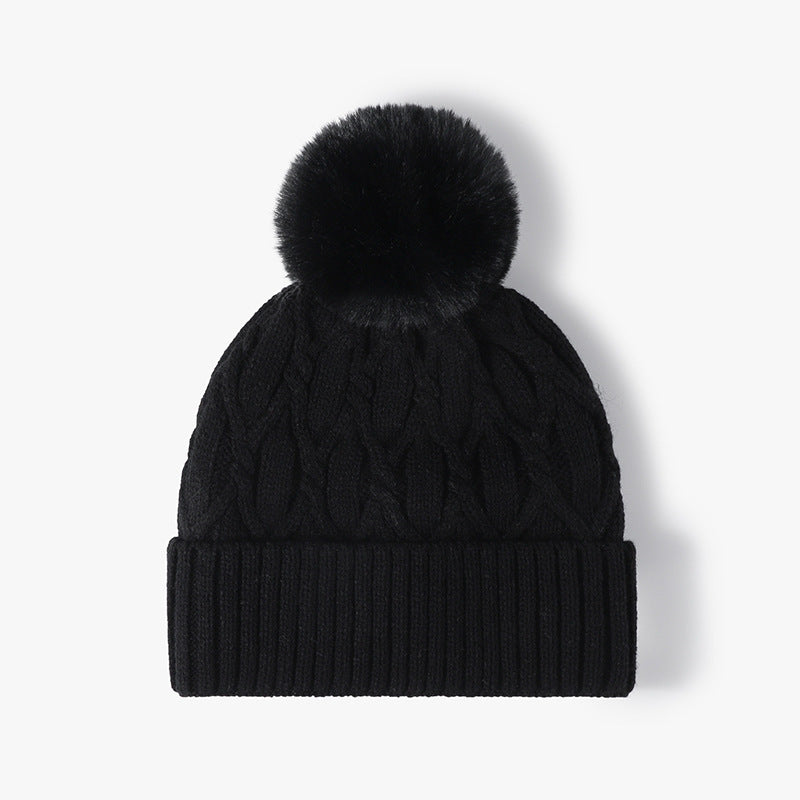 Black cable knit pom-pom cuffed beanie product view