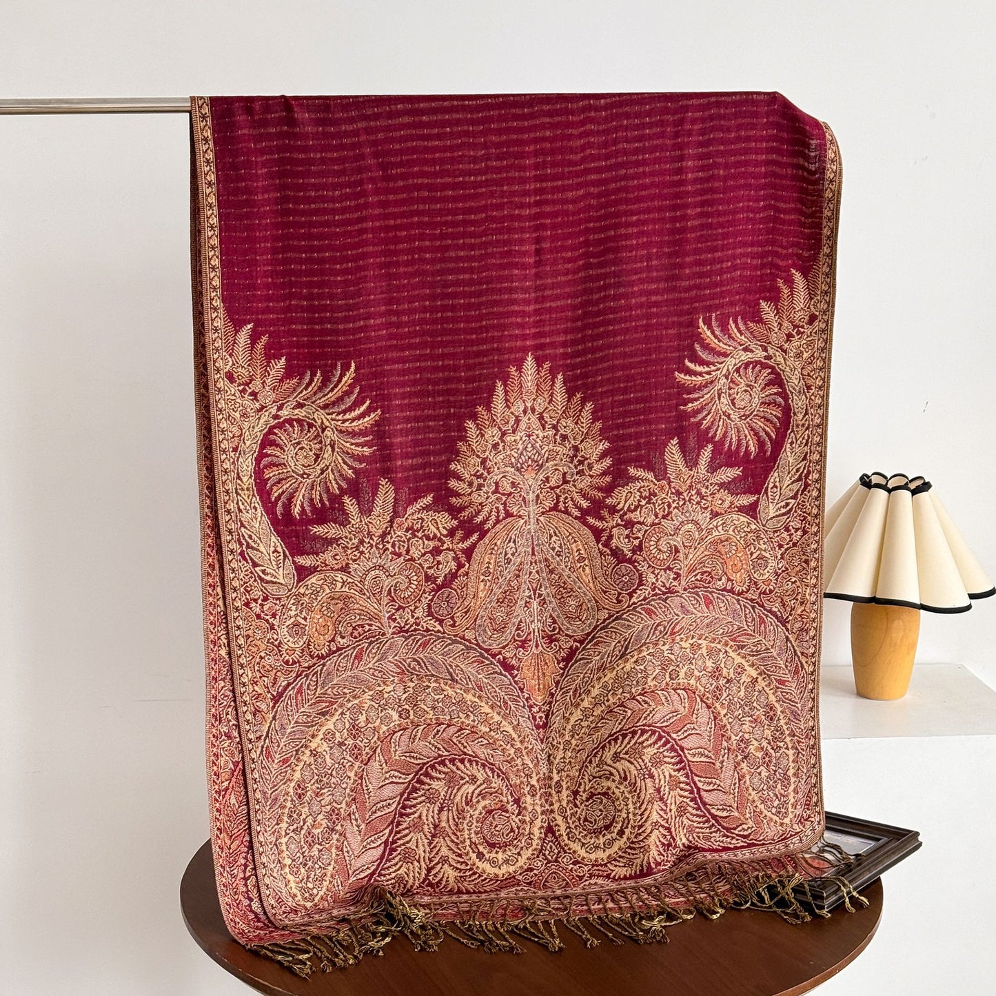 Detailed view of tassel edges on paisley scarf