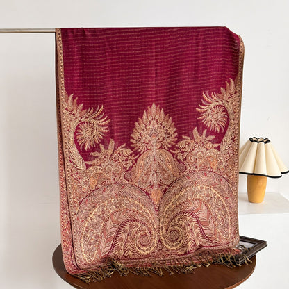 Detailed view of tassel edges on paisley scarf