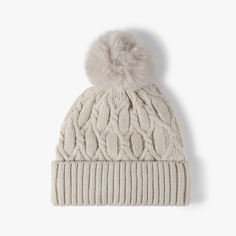 Beige cable knit pom-pom cuffed beanie product view