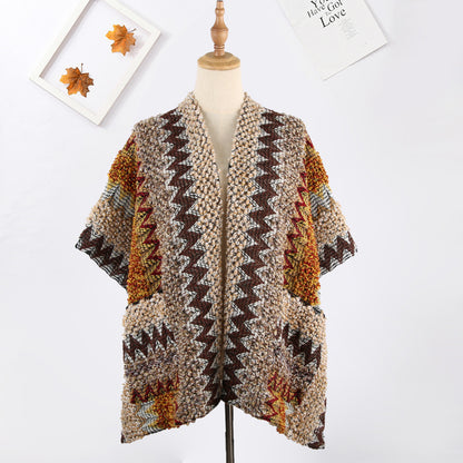 Scarvii boho shawl with pocket draped over a surface highlighting fabric details