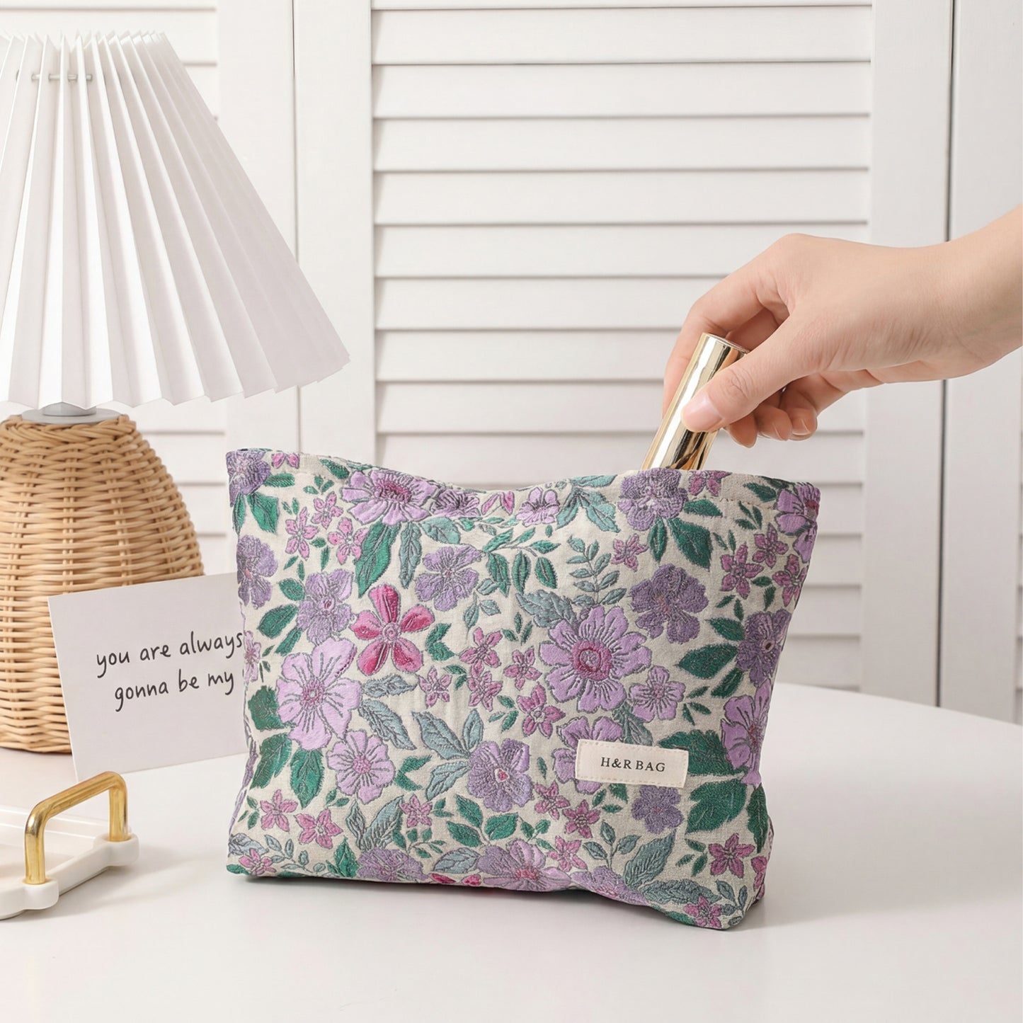 Close-up of Cosbai textured flower cosmetic bag showing floral pattern and chain strap