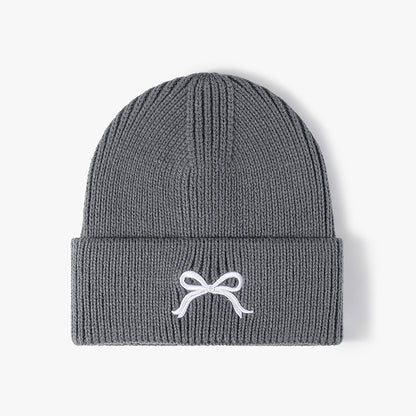 秋冬季蝴蝶结刺绣女士户外保暖针织帽欧美跨境晴纶加厚毛细护耳帽