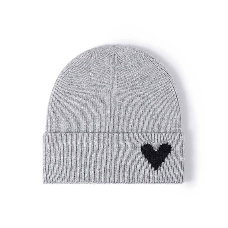 Pink heart accent cuffed knit beanie product view