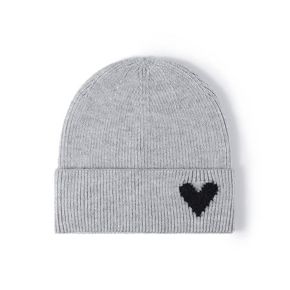 Pink heart accent cuffed knit beanie product view