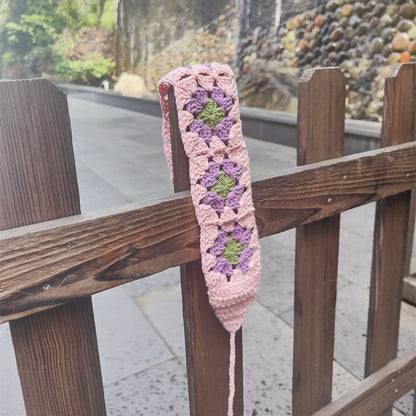 Side view of Scarvii crochet flower hairband highlighting flower decoration