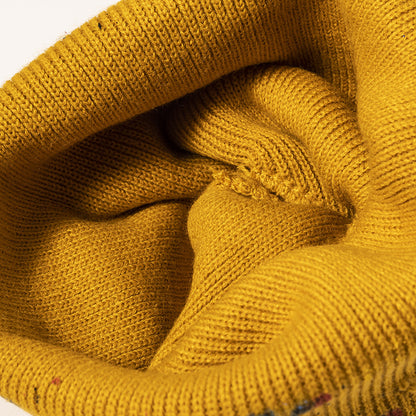 Yellow paint splatter cuffed knit beanie detail