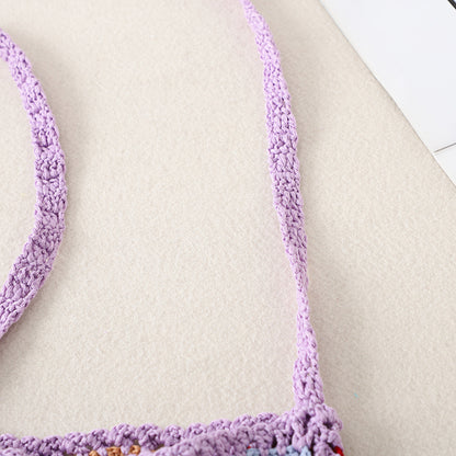 Close-up of tassel detail on Cosbai Bohemian crochet crossbody bag
