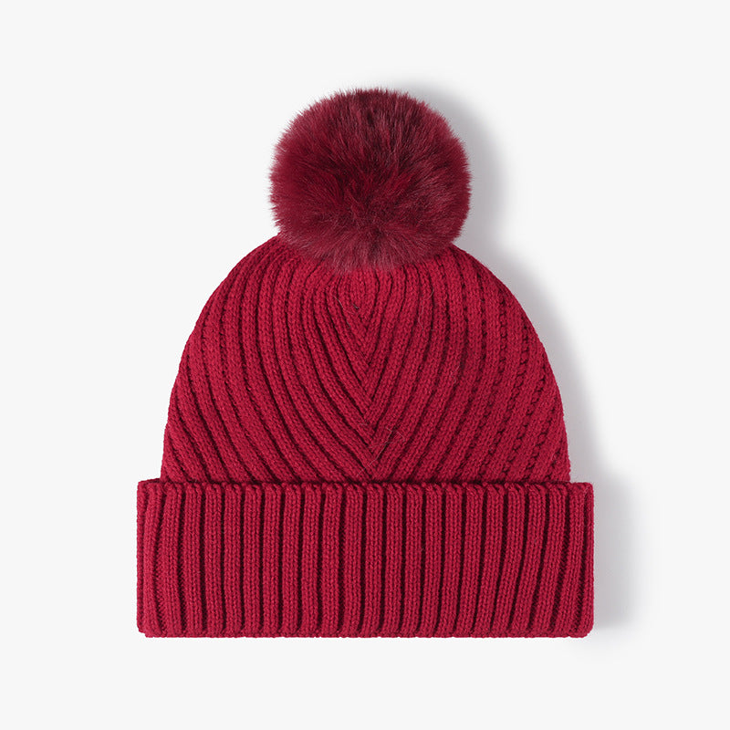 Burgundy pom-pom faux fur-lined cuffed knit beanie product view